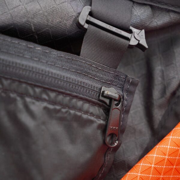 ULA Internal Stash Pocket clippes into pack with two beefy clips.