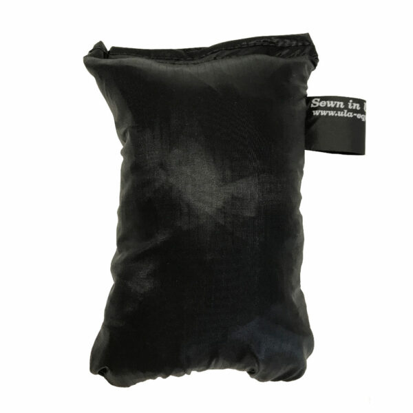 An ultralight ULA Pack Cover in it's built-in stuff sack in the color Black.