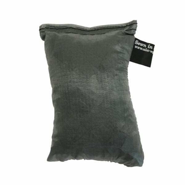 An ultralight ULA Pack Cover in it's built-in stuff sack in the color Grey.