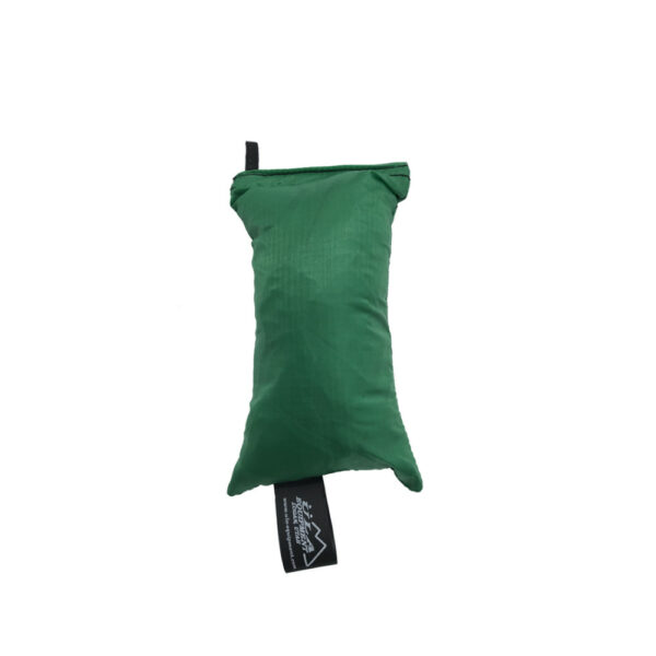 An ultralight ULA Rain Kilt in it's built-in stuff sack in the color Green.