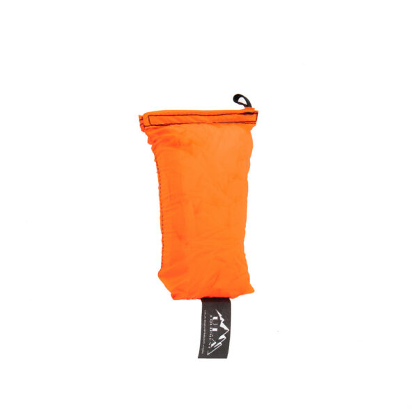 An ultralight ULA Rain Kilt in it's built-in stuff sack in the color Fluorescent Orange