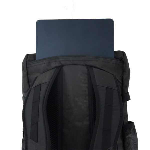 A photo of the ULA Dragonfly's Zippered Laptop Sleeve located on the top of the backpack and accessed va the exterior zipper.
