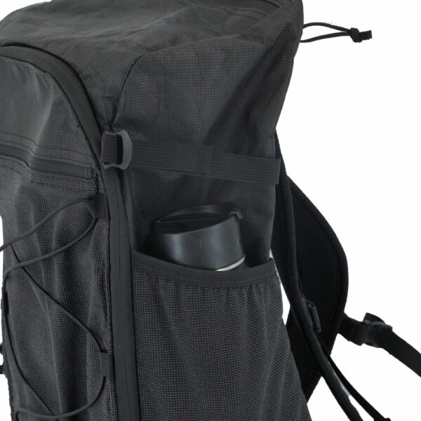 A close up of the ULA Dragonfly daypack's side pockets for holing water bottles, etc.