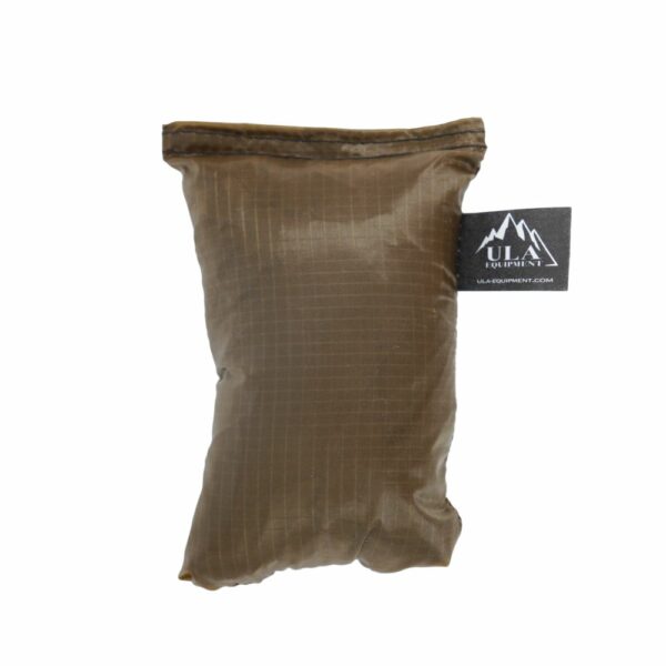 An ultralight ULA Pack Cover in it's built-in stuff sack in the color Desert Brown.