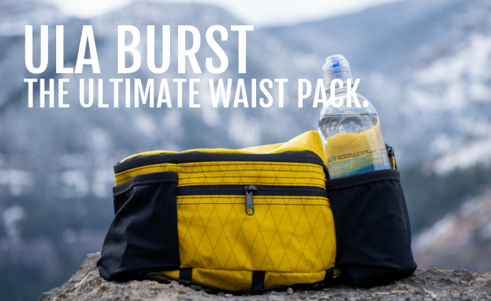 A VX21 Federal Yellow colored ULA Burst fanny pack/ waist pack with a .5 L bottle in the water bottle pocket.