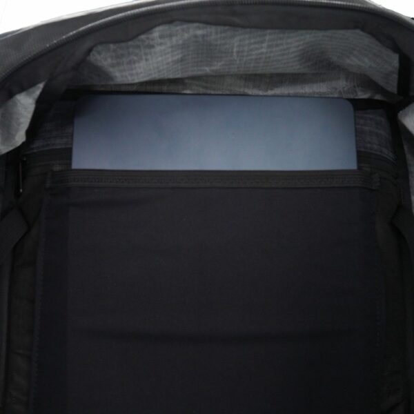 A close up view of the ULA ULTRA Camino stretch mesh laptop pocket .