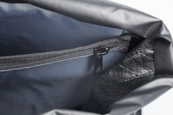 A close up view of the ULA Packrat Daypack Internal Zippered Pocket
