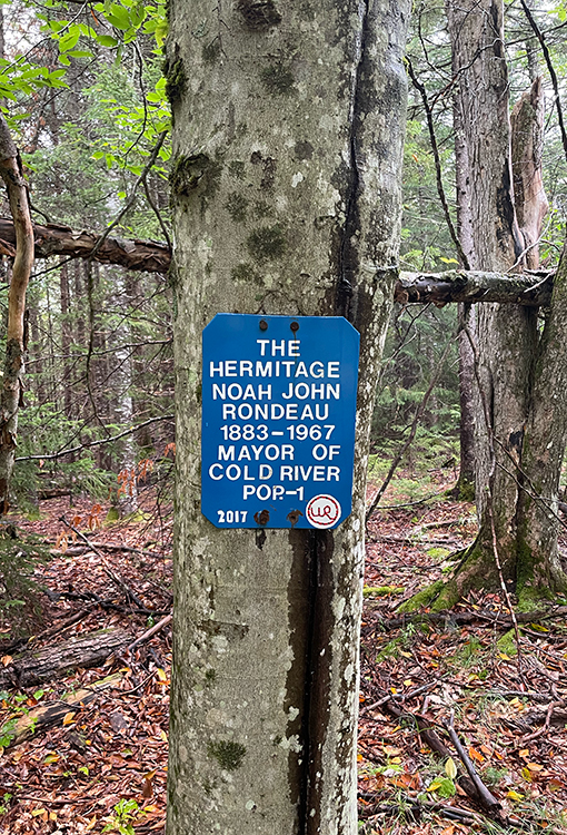 A BearVault being opened by a hiker. The BearVault also keeps your snacks from getting crushed.