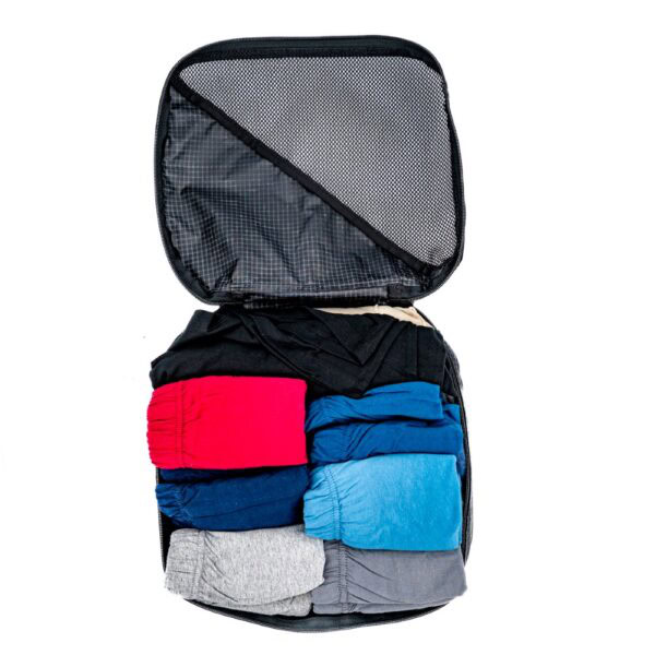 ULA Packing Cube open and packed with clothing.
