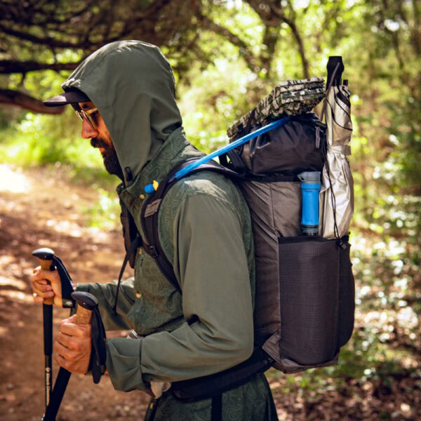 Ultralight hiker using ULA Packrat daypack to carry all his gear