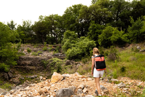 Day hiker wearing coral X-pac Packrat