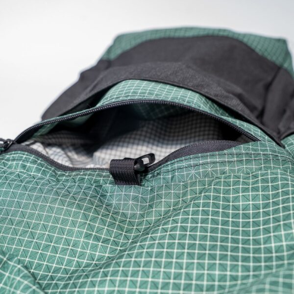 ULA Brushed Green Robic Node with open front zippered pocket, showing pocket size.