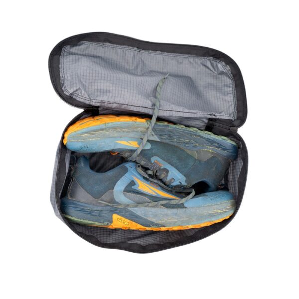 ULA Shoe Packing Cube in Castlerock containing a pair of hiking shoes.