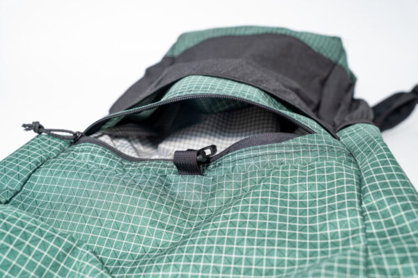 ULA Brushed Green Robic Node with open front zippered pocket, showing pocket size.