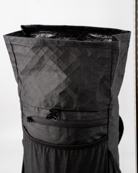 An open view of the ULA Ultra Node Daypack, showing the roll-top closer fully open. It adds extra space to the pack.