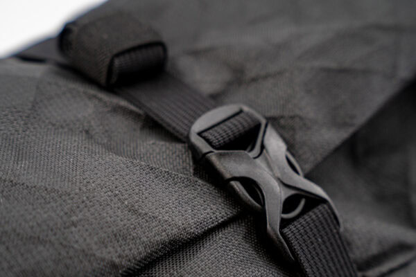 A close up view of the buckles and Strap Keeper on a ULA Node backpack. The strap keeper keeps excess straps organized.