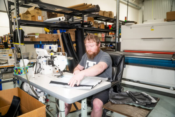 A ULA team member sews a new pack in the ULA manufacturing facility in Logan, Utah