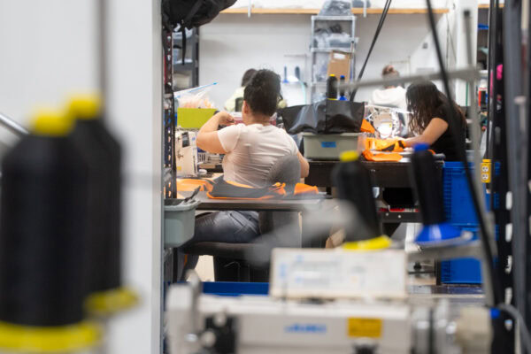 Members of our team sewing new packs in the ULA manufacturing facility in Logan Utah.