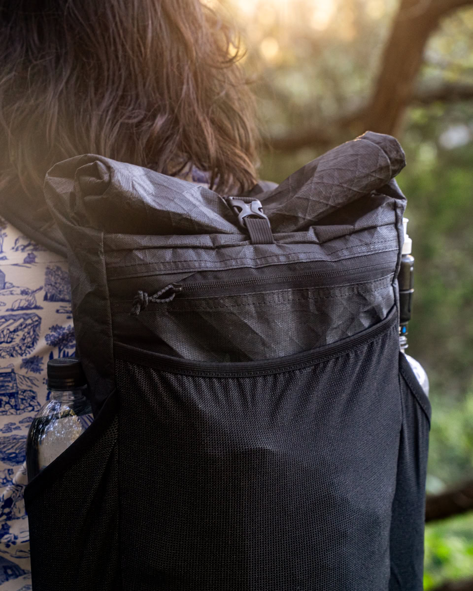 node outdoor-13 Backpacker puts a Bear Vault Bear Canister into a ULA CDT Backpack