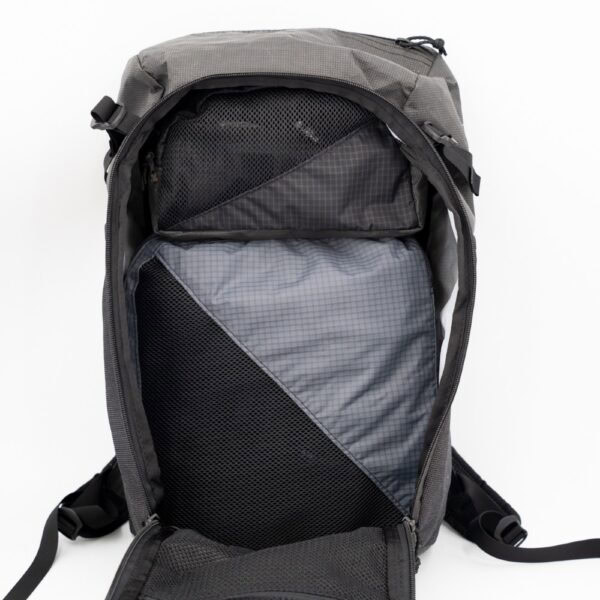 The ULA Toiletry Kit kits perfectly in the Dragonfly on top of the ULA Packing Cubes, keeping the pack very organized