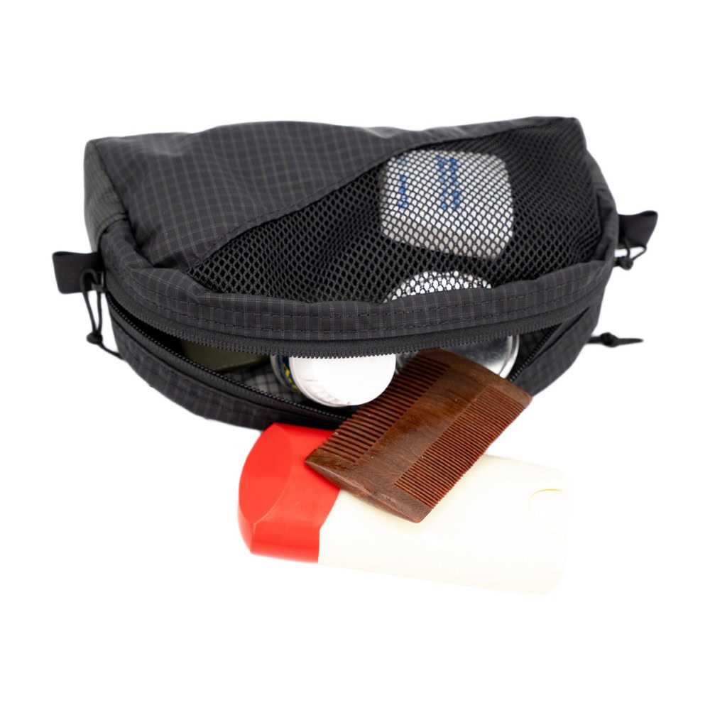 ULA Toiltry Kit: On it's side The ULA Toiltry kit on its side with toiletries spilling out.