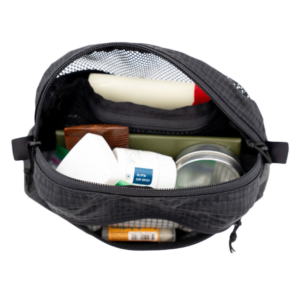 ULA Toiltry Kit: Inside Loaded Interior of ULA toiletries Kit. Inside is filled with toiletries.