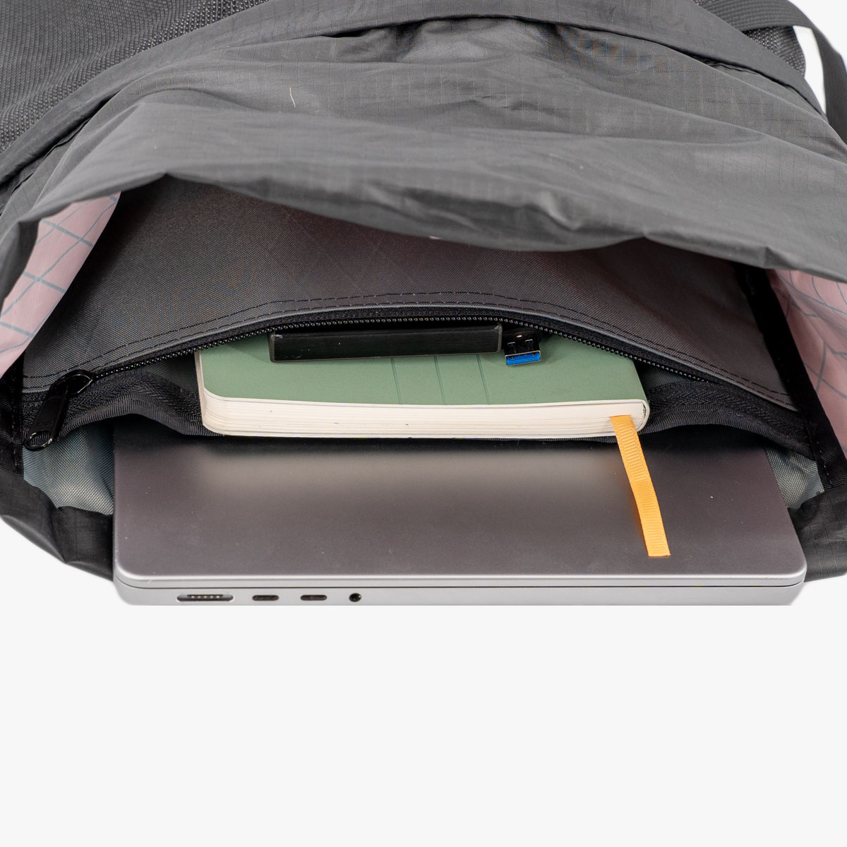 Packrat compartments A laptop and notebook inside of a packrat
