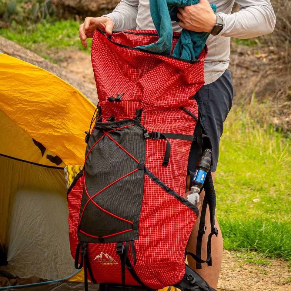 73bcec08-0eda-275a-ae55-44608de5568b A catalyst backpack being loaded