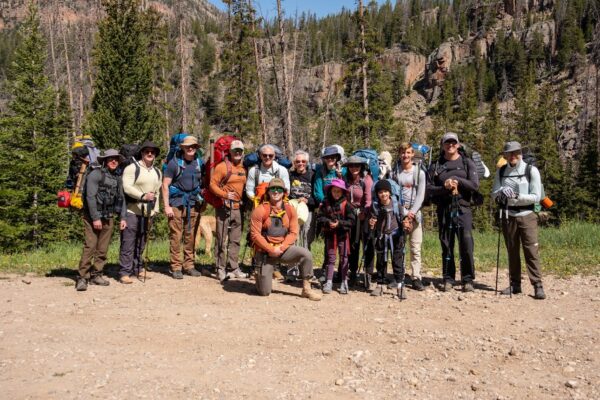 A group of backpackers pose for a photo