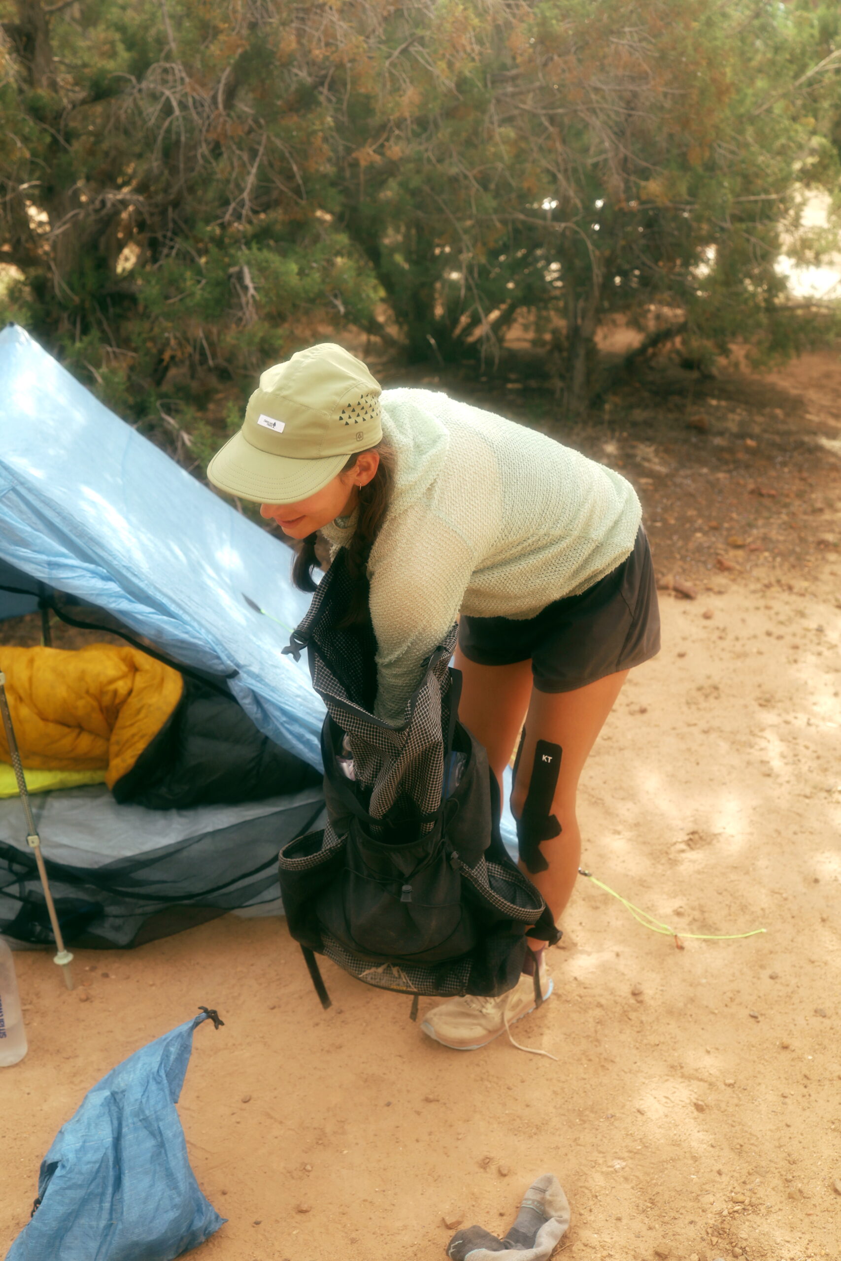 Baja Packing up A woman packs her backpack on the Arizona Trail