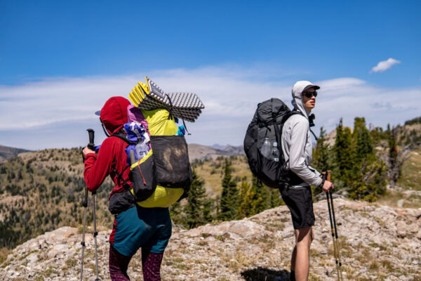 a man and woman backpacking