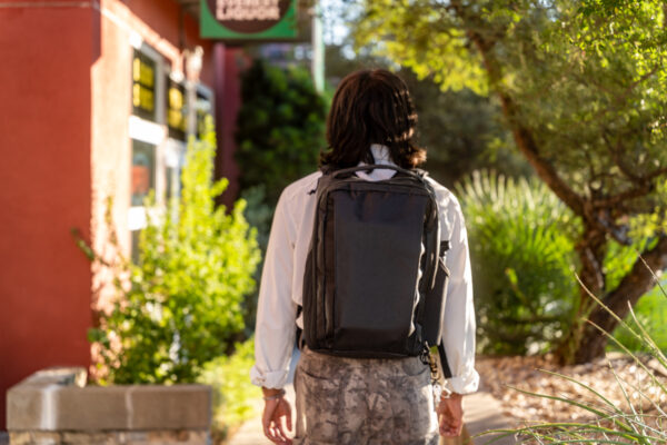 A man walks down the street wearing the Cicada w/ pockets