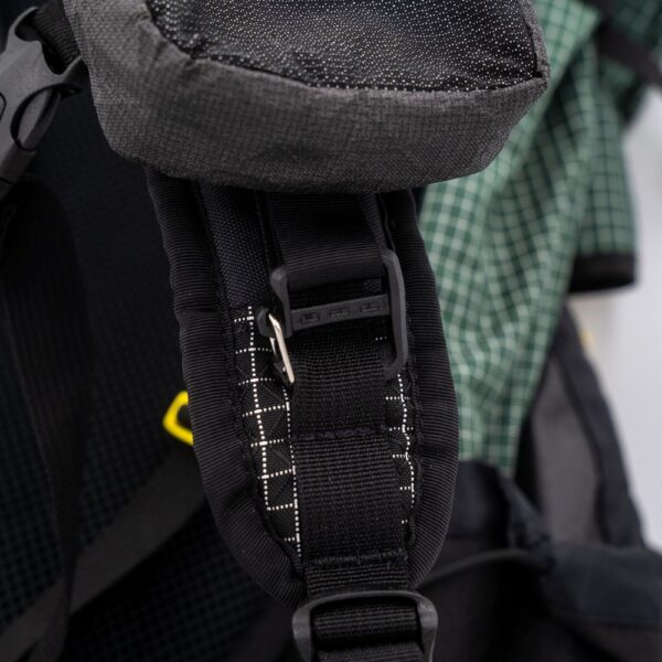 Images shows how the ULA Ultra Polarity Pocket clips to the pack