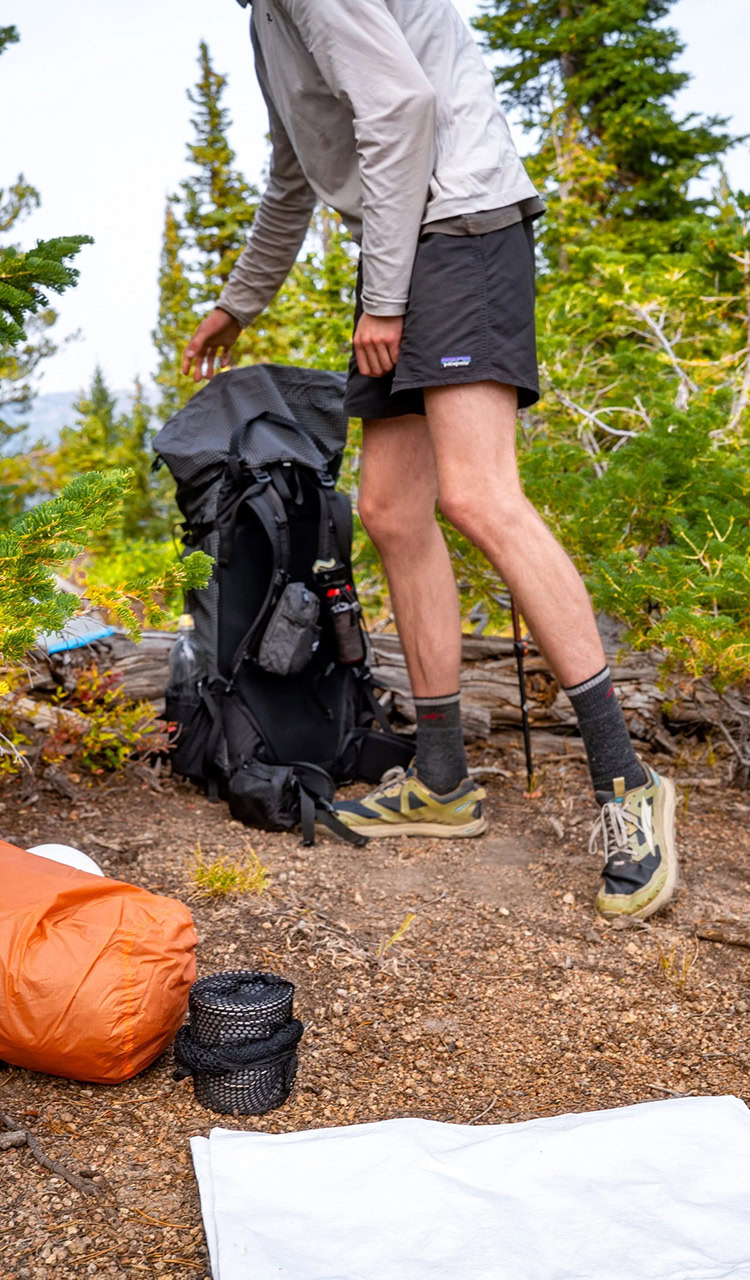 A man loading a backpack