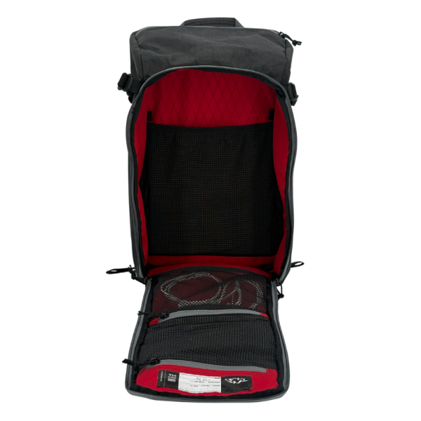A front view of the Bespoke 36L Dragonfly 0226 Dia de los Muertos fulley open showing the true red interior and interior pocket system