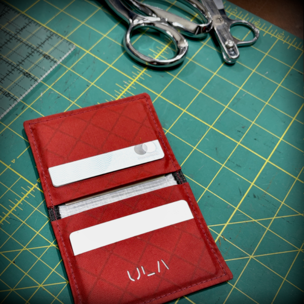 Brick red Wasatch Wallet open on the cutting table