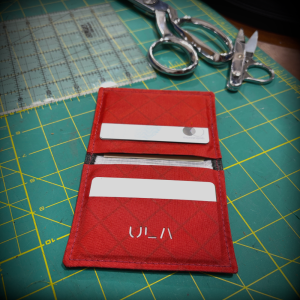 Brick red Wasatch Wallet open on the cutting table
