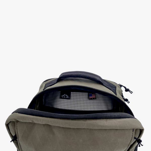 A top down view of the x50 Cicada EWP in Ranger Green with the zipper open exposing the interior