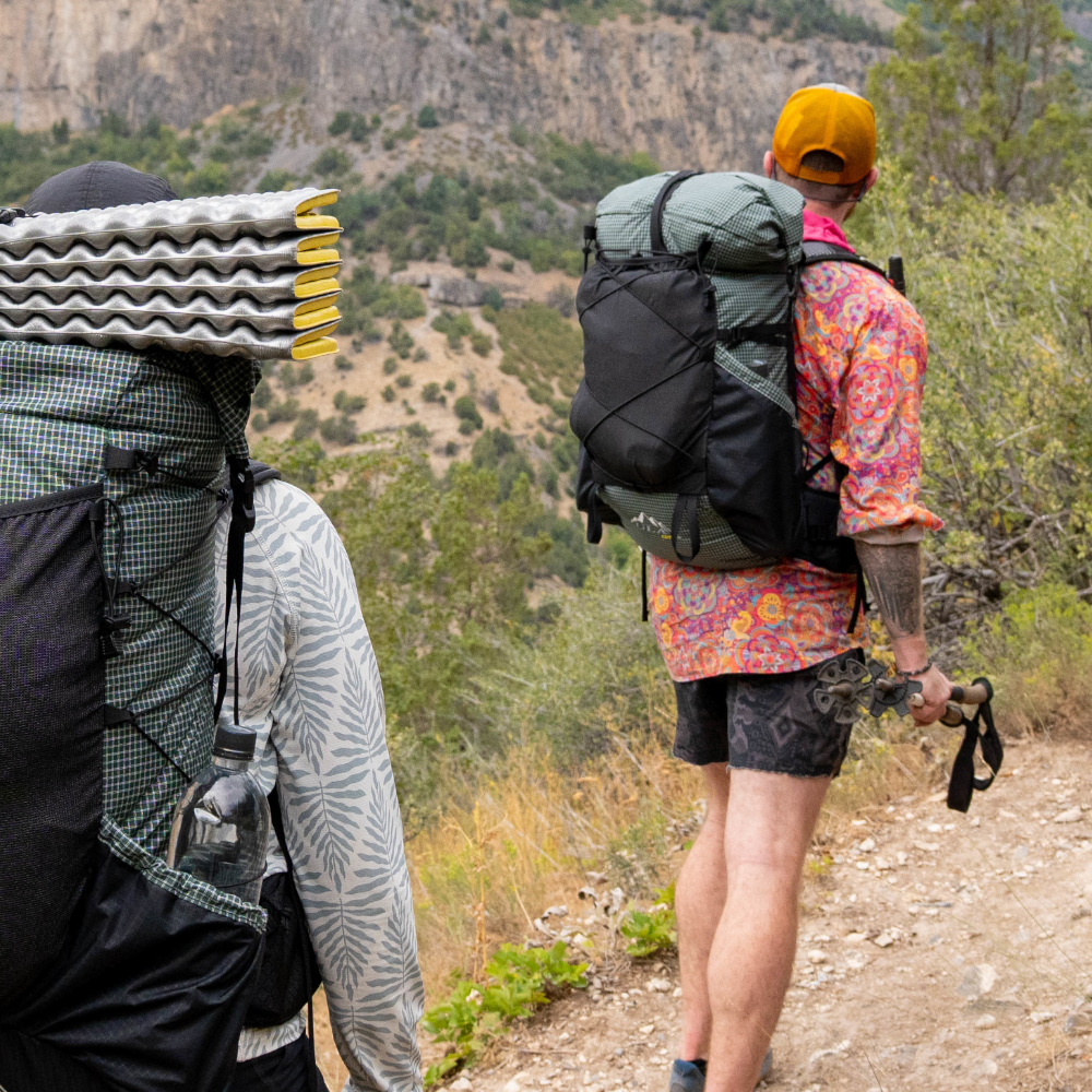 A hiker wears the 2026 UltraGrid CDT on a trail